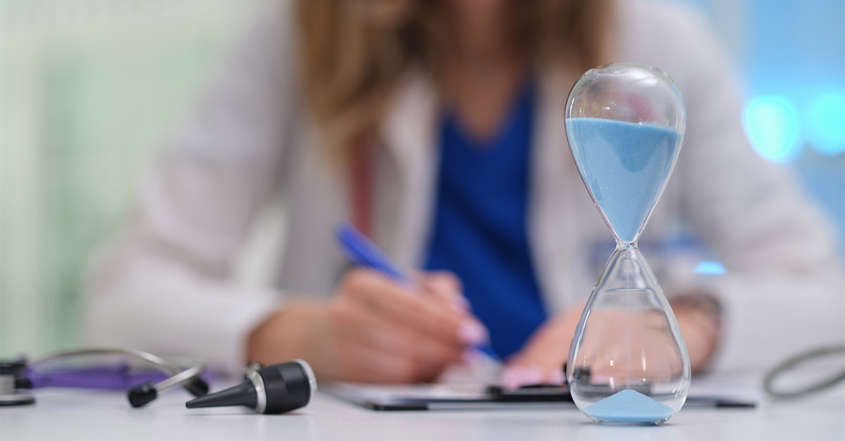 Physician holding an hourglass, symbolizing time-sensitive expiration of rural Medicare enhancements (LVH & MDH) on September 30, 2025