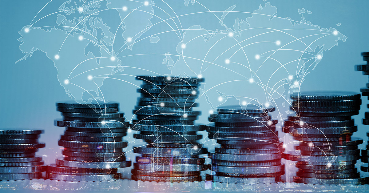 Stacks of coins connected by a glowing digital world map, symbolizing international finance, taxation, and global transfer pricing networks.