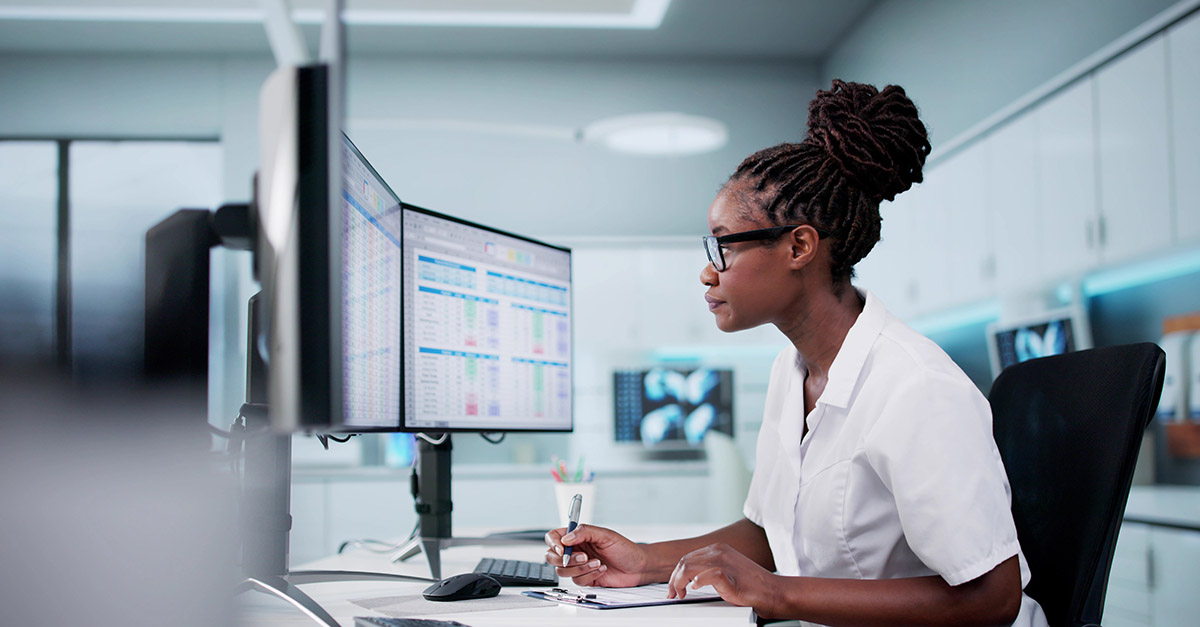 Hospital analyst reviewing episode cost and post-acute utilization data on a dashboard in preparation for CMS TEAM payment model transition