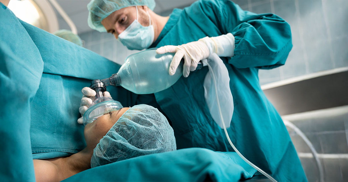 CRNA preparing anesthesia equipment in a hospital setting representing compensation and staffing strategy