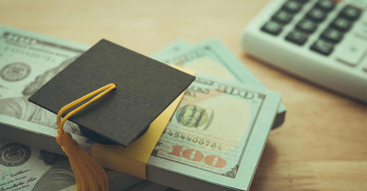 Graduation cap on U.S. currency representing the Education Freedom Tax Credit, Scholarship Granting Organizations, and federal education tax incentives
