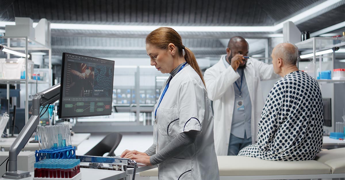 Healthcare research team reviewing clinical trial documentation and patient data, representing research compliance, Medicare Coverage Analysis, and clinical research oversight