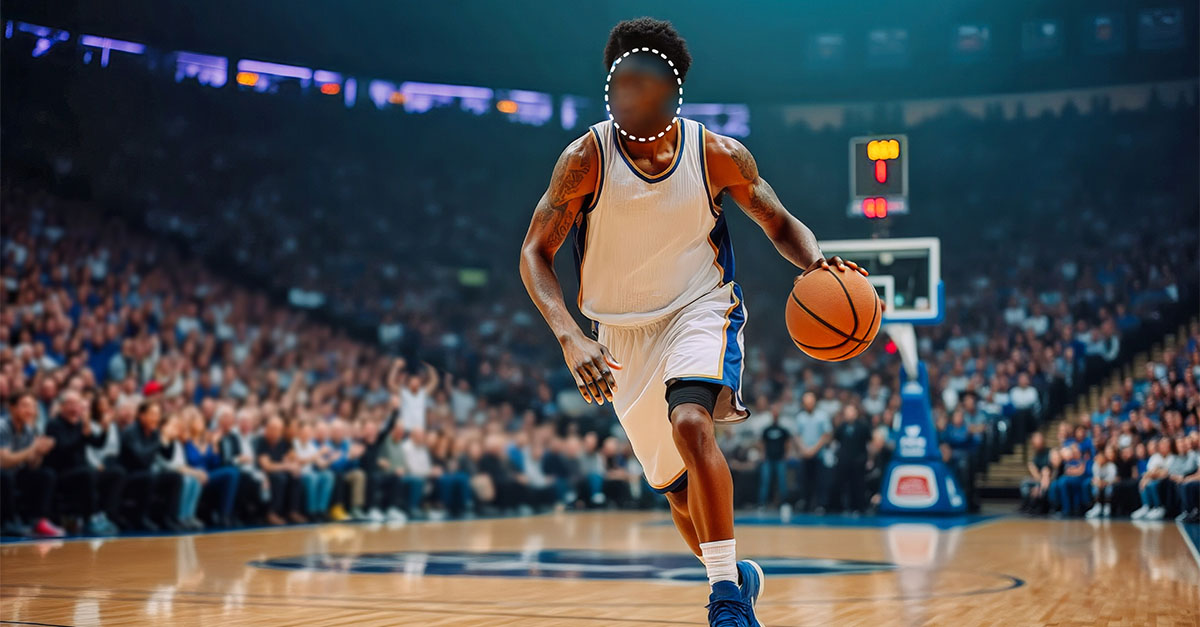 Basketball player dribbling on a court in a crowded arena