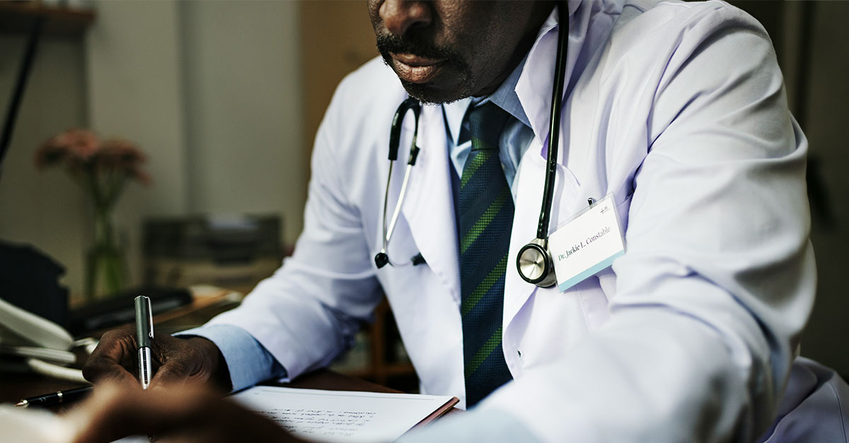 Physician reviewing documentation for clinical trial financial activation readiness